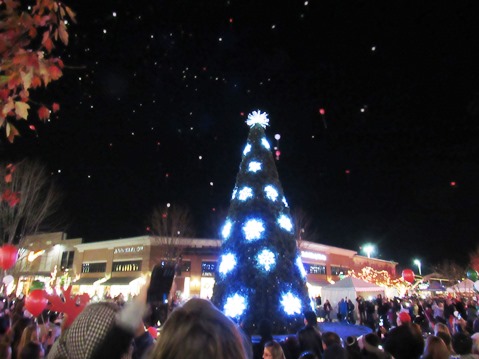 A 45-foot tree with a synchronized lighting display was lit tonight at the Legends Outlets in Kansas City, Kan. Balloons also were released. (Staff photo by Mary Rupert)