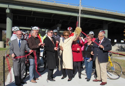 UG Commissioner Gayle Townsend, center, celebrated as the ribbon was cut for the Kaw Point Park Connector Trail today. (Staff photo by Mary Rupert)