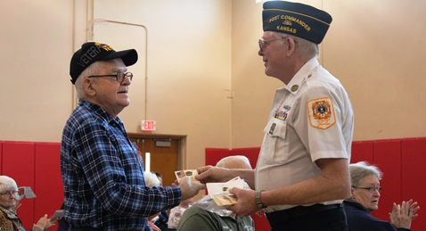 Receiving a Korea veteran pin at the Wyandotte County Veterans Day Commemoration on Saturday, Nov. 5, at the Salvation Army Harbor Light Village, 6723 State Ave., Kansas City, Kan. (Photo by Steve Rupert)