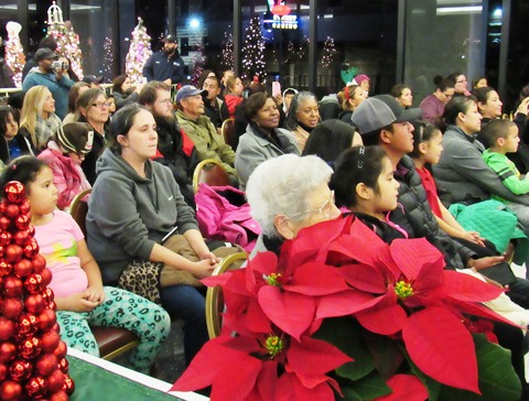 A crowd enjoyed holiday music at the lighting ceremony Friday night at Kansas City, Kan., City Hall. (Staff photo by Mary Rupert)