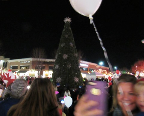 Many people took photos of themselves at the holiday tree lighting ceremony tonight at the Legends Outlets in Kansas City, Kan., and are entering the photos in a contest. (Staff photo by Mary Rupert)