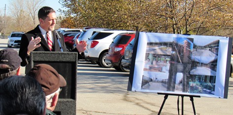 Mayor Mark Holland with a drawing of the trail and improvements. (Staff photo by Mary Rupert)