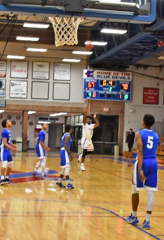 Mike Lee’s dramatic game-tying 50-foot shot was in the air with 0.4 seconds left before it settled in the nets to force overtime in KCKCC’s 80-78 loss to Iowa Western Tuesday. (KCKCC photo by Alan Hoskins)