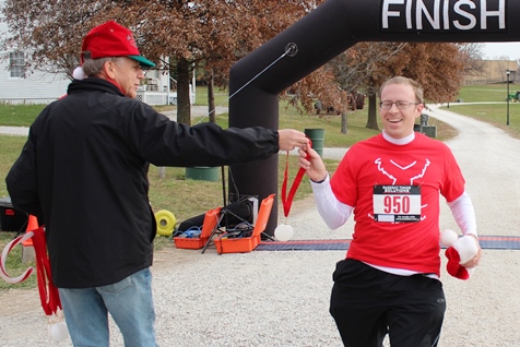 It’s not always about how you start. Sometimes it’s about how you finish. Runners at the Santa Express 5K and Reindeer Route at the National Agricultural Center and Hall of Fame, Bonner Springs, finished their 5K and 1-mile routes Saturday with style. (Photo by Steve Rupert)