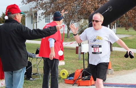 It’s not always about how you start. Sometimes it’s about how you finish. Runners at the Santa Express 5K and Reindeer Route at the National Agricultural Center and Hall of Fame, Bonner Springs, finished their 5K and 1-mile routes Saturday with style. (Photo by Steve Rupert)