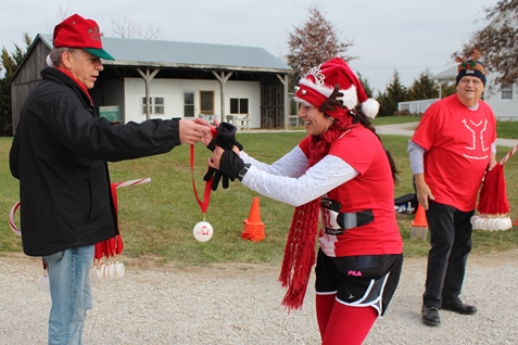 It’s not always about how you start. Sometimes it’s about how you finish. Runners at the Santa Express 5K and Reindeer Route at the National Agricultural Center and Hall of Fame, Bonner Springs, finished their 5K and 1-mile routes Saturday with style. (Photo by Steve Rupert)