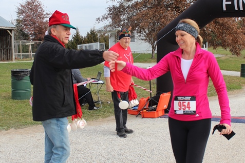 It’s not always about how you start. Sometimes it’s about how you finish. Runners at the Santa Express 5K and Reindeer Route at the National Agricultural Center and Hall of Fame, Bonner Springs, finished their 5K and 1-mile routes Saturday with style. (Photo by Steve Rupert)