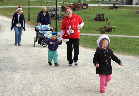 It’s not always about how you start. Sometimes it’s about how you finish. Runners at the Santa Express 5K and Reindeer Route at the National Agricultural Center and Hall of Fame, Bonner Springs, finished their 5K and 1-mile routes Saturday with style. (Photo by Steve Rupert)