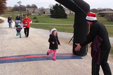 It’s not always about how you start. Sometimes it’s about how you finish. Runners at the Santa Express 5K and Reindeer Route at the National Agricultural Center and Hall of Fame, Bonner Springs, finished their 5K and 1-mile routes Saturday with style. (Photo by Steve Rupert)