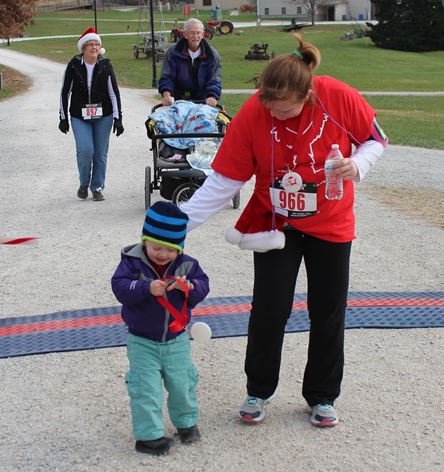 It’s not always about how you start. Sometimes it’s about how you finish. Runners at the Santa Express 5K and Reindeer Route at the National Agricultural Center and Hall of Fame, Bonner Springs, finished their 5K and 1-mile routes Saturday with style. (Photo by Steve Rupert)