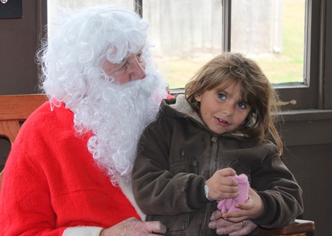 What do I want for Christmas? Let me think ... Children met with Santa Claus on Saturday at the National Agricultural Center and Hall of Fame, Bonner Springs, to talk about their Christmas wishes. More visits with Santa Claus are scheduled from 10 a.m. to 2 p.m. Sunday, Dec. 4, Saturday, Dec. 10, and Sunday, Dec. 11, at the Ag Hall, 126th and State Avenue, Bonner Springs. For more information, visit http://www.aghalloffame.com. (Photo by Steve Rupert)