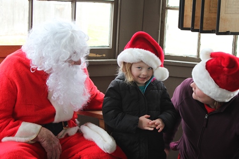 What do I want for Christmas? Let me think ... Children met with Santa Claus on Saturday at the National Agricultural Center and Hall of Fame, Bonner Springs, to talk about their Christmas wishes. More visits with Santa Claus are scheduled from 10 a.m. to 2 p.m. Sunday, Dec. 4, Saturday, Dec. 10, and Sunday, Dec. 11, at the Ag Hall, 126th and State Avenue, Bonner Springs. For more information, visit http://www.aghalloffame.com. (Photo by Steve Rupert)