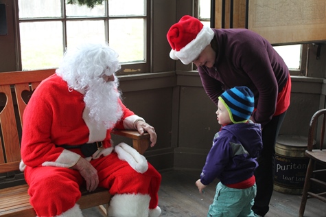 What do I want for Christmas? Let me think ... Children met with Santa Claus on Saturday at the National Agricultural Center and Hall of Fame, Bonner Springs, to talk about their Christmas wishes. More visits with Santa Claus are scheduled from 10 a.m. to 2 p.m. Sunday, Dec. 4, Saturday, Dec. 10, and Sunday, Dec. 11, at the Ag Hall, 126th and State Avenue, Bonner Springs. For more information, visit http://www.aghalloffame.com. (Photo by Steve Rupert)