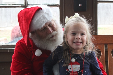 What do I want for Christmas? Let me think ... Children met with Santa Claus on Saturday at the National Agricultural Center and Hall of Fame, Bonner Springs, to talk about their Christmas wishes. More visits with Santa Claus are scheduled from 10 a.m. to 2 p.m. Sunday, Dec. 4, Saturday, Dec. 10, and Sunday, Dec. 11, at the Ag Hall, 126th and State Avenue, Bonner Springs. For more information, visit http://www.aghalloffame.com. (Photo by Steve Rupert)