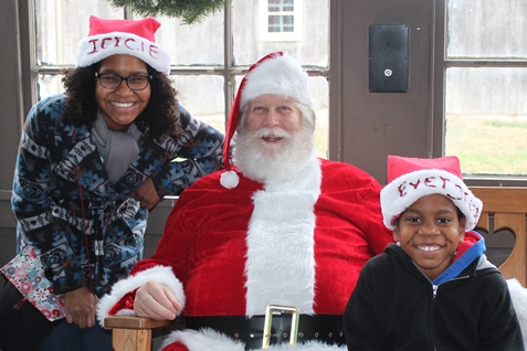 What do I want for Christmas? Let me think ... Children met with Santa Claus on Saturday at the National Agricultural Center and Hall of Fame, Bonner Springs, to talk about their Christmas wishes. More visits with Santa Claus are scheduled from 10 a.m. to 2 p.m. Sunday, Dec. 4, Saturday, Dec. 10, and Sunday, Dec. 11, at the Ag Hall, 126th and State Avenue, Bonner Springs. For more information, visit http://www.aghalloffame.com. (Photo by Steve Rupert)