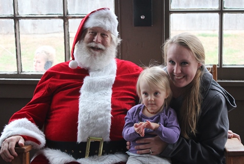 What do I want for Christmas? Let me think ... Children met with Santa Claus on Saturday at the National Agricultural Center and Hall of Fame, Bonner Springs, to talk about their Christmas wishes. More visits with Santa Claus are scheduled from 10 a.m. to 2 p.m. Sunday, Dec. 4, Saturday, Dec. 10, and Sunday, Dec. 11, at the Ag Hall, 126th and State Avenue, Bonner Springs. For more information, visit http://www.aghalloffame.com. (Photo by Steve Rupert)