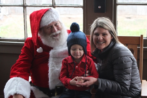 What do I want for Christmas? Let me think ... Children met with Santa Claus on Saturday at the National Agricultural Center and Hall of Fame, Bonner Springs, to talk about their Christmas wishes. More visits with Santa Claus are scheduled from 10 a.m. to 2 p.m. Sunday, Dec. 4, Saturday, Dec. 10, and Sunday, Dec. 11, at the Ag Hall, 126th and State Avenue, Bonner Springs. For more information, visit http://www.aghalloffame.com. (Photo by Steve Rupert)