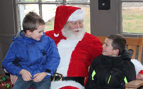 What do I want for Christmas? Let me think ... Children met with Santa Claus on Saturday at the National Agricultural Center and Hall of Fame, Bonner Springs, to talk about their Christmas wishes. More visits with Santa Claus are scheduled from 10 a.m. to 2 p.m. Sunday, Dec. 4, Saturday, Dec. 10, and Sunday, Dec. 11, at the Ag Hall, 126th and State Avenue, Bonner Springs. For more information, visit http://www.aghalloffame.com. (Photo by Steve Rupert)