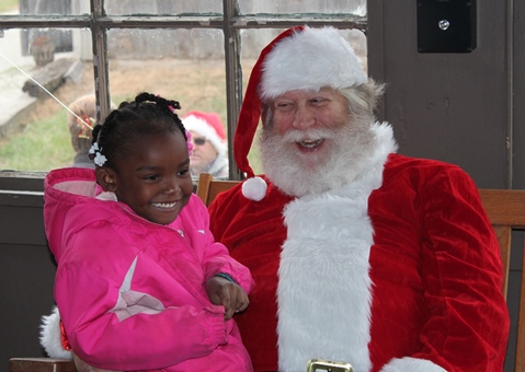 What do I want for Christmas? Let me think ... Children met with Santa Claus on Saturday at the National Agricultural Center and Hall of Fame, Bonner Springs, to talk about their Christmas wishes. More visits with Santa Claus are scheduled from 10 a.m. to 2 p.m. Sunday, Dec. 4, Saturday, Dec. 10, and Sunday, Dec. 11, at the Ag Hall, 126th and State Avenue, Bonner Springs. For more information, visit http://www.aghalloffame.com. (Photo by Steve Rupert)