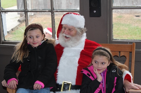 What do I want for Christmas? Let me think ... Children met with Santa Claus on Saturday at the National Agricultural Center and Hall of Fame, Bonner Springs, to talk about their Christmas wishes. More visits with Santa Claus are scheduled from 10 a.m. to 2 p.m. Sunday, Dec. 4, Saturday, Dec. 10, and Sunday, Dec. 11, at the Ag Hall, 126th and State Avenue, Bonner Springs. For more information, visit http://www.aghalloffame.com. (Photo by Steve Rupert)