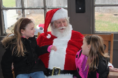 What do I want for Christmas? Let me think ... Children met with Santa Claus on Saturday at the National Agricultural Center and Hall of Fame, Bonner Springs, to talk about their Christmas wishes. More visits with Santa Claus are scheduled from 10 a.m. to 2 p.m. Sunday, Dec. 4, Saturday, Dec. 10, and Sunday, Dec. 11, at the Ag Hall, 126th and State Avenue, Bonner Springs. For more information, visit http://www.aghalloffame.com. (Photo by Steve Rupert)