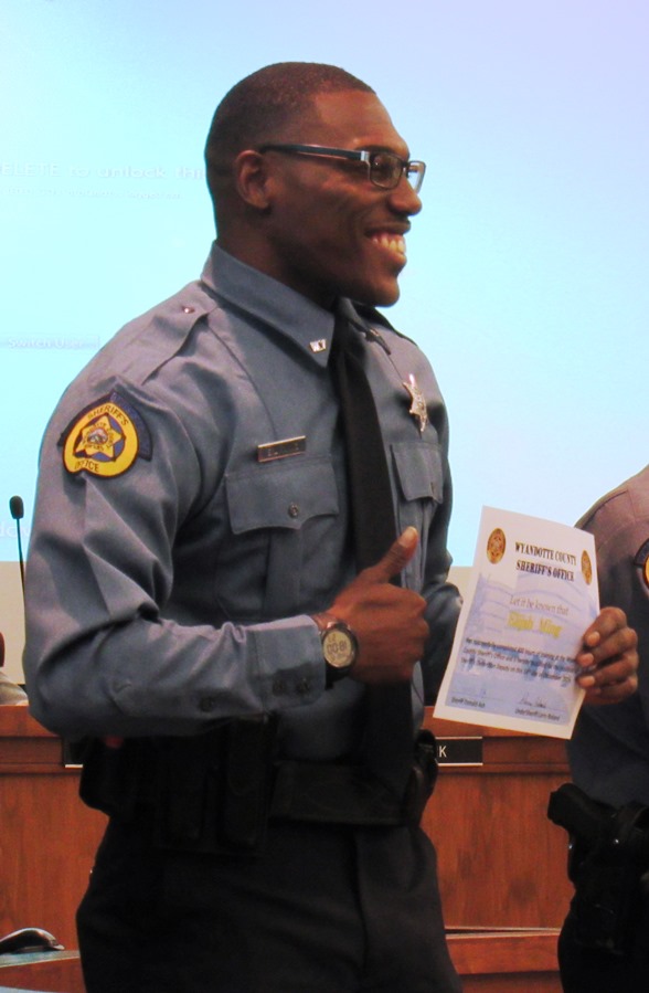 New sheriff’s deputy Elijah Ming displayed his certificate Dec. 15 at graduation ceremonies at Kansas City, Kan., City Hall. (Staff photo by Mary Rupert) 