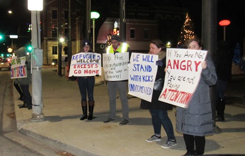 A small group of people held a protest about 6 p.m. Dec. 15 outside City Hall. “We’re not going back,” said one of the signs that they were holding. Several issues were mentioned, including immigration. The Wyandotte Rally for Solidarity stated all people deserved to be free from fear so that together they could build the world they want. (Staff photo by Mary Rupert) 