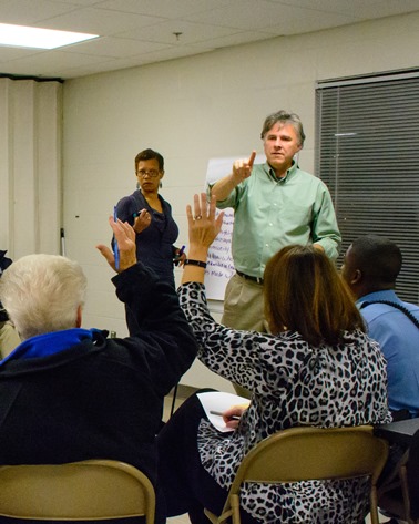 Group discussion facilitator Mark Wiebe asked participants to vote for the barriers to a safer community that they considered the most important. (Photo by Brian Turrel)