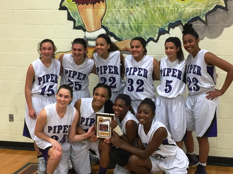 The Piper girls basketball team won the Eudora-Paola championship tournament game 59-55 in double overtime against Paola on Dec. 8. (Piper district photo)