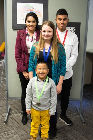 Recognized as students of the month recently were Ivan Hernandez-Jimenez, front, pre-kindergarten at Morse Early Childhood Center; middle row, Kylie Hamilton, New Stanley Elementary; and back row, left to right, Rosa Hernandez, Harmon High School; Alejandro Martinez, Argentine Middle School. (Photo from Kansas City, Kan., Public Schools)